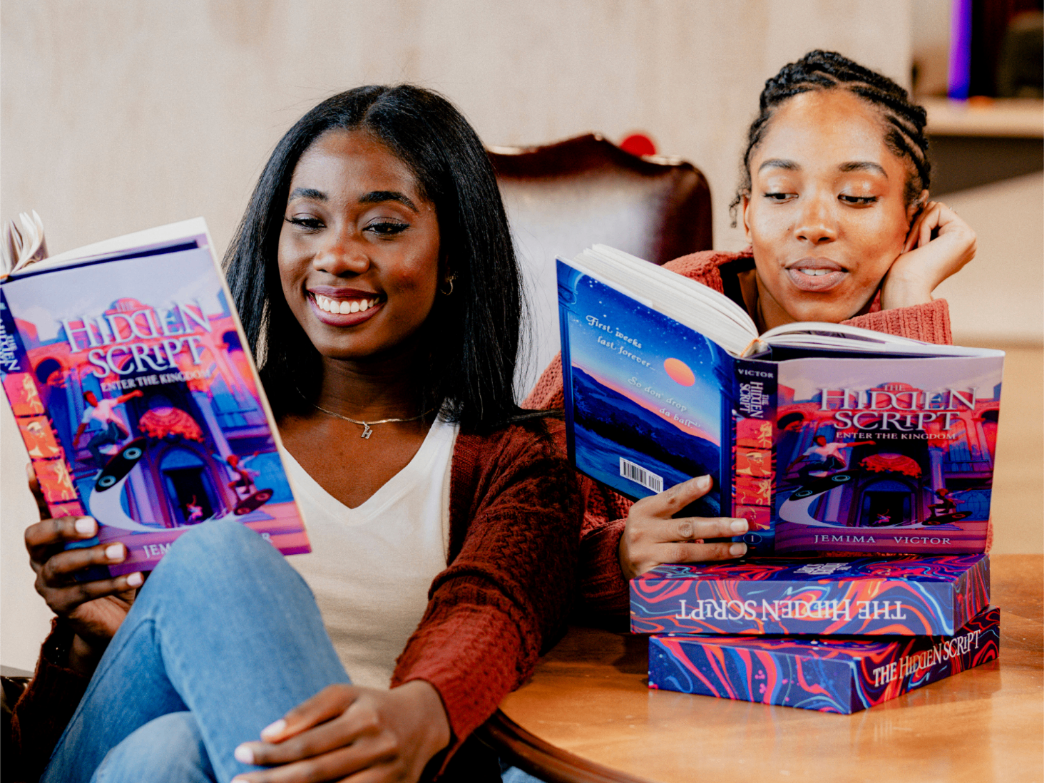 Two readers enjoying The Hidden Script by Jemima Victor